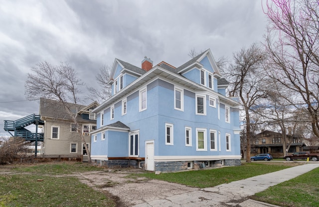 view of home's exterior featuring a lawn