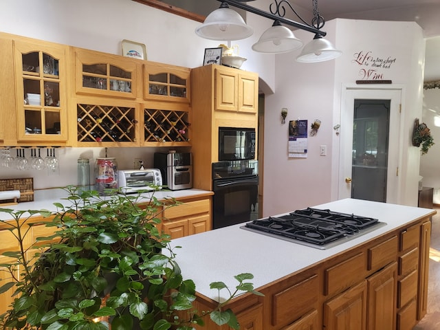 kitchen with decorative light fixtures and black appliances