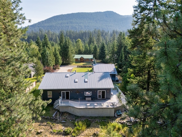 birds eye view of property featuring a mountain view