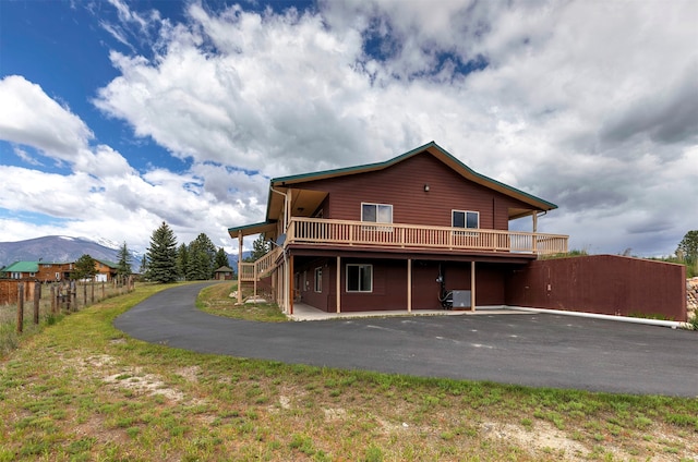 rear view of property featuring a mountain view