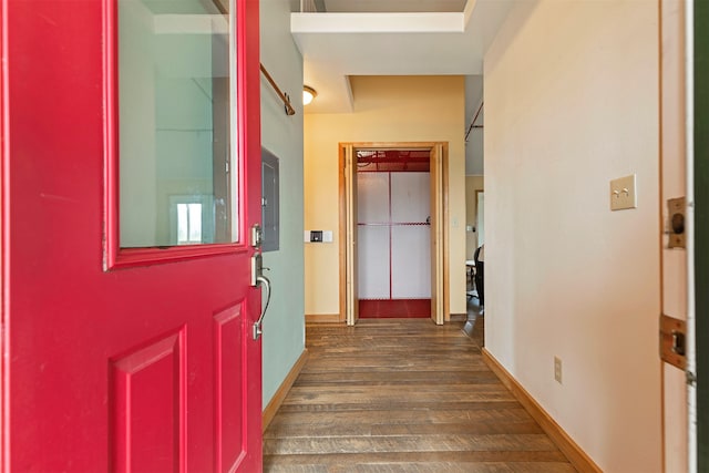 corridor featuring dark hardwood / wood-style floors