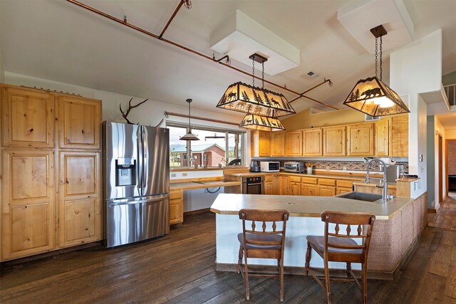 kitchen featuring stainless steel appliances, dark wood-type flooring, sink, and backsplash