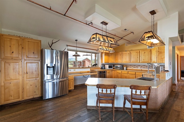 5282 Otto Way, Florence, MT 59833 - kitchen featuring stainless steel fridge, dark wood-style floors, light brown cabinetry, hanging light fixtures, and decorative backsplash