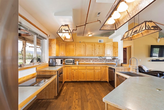 kitchen featuring hanging light fixtures, stainless steel appliances, dark hardwood / wood-style floors, sink, and tasteful backsplash