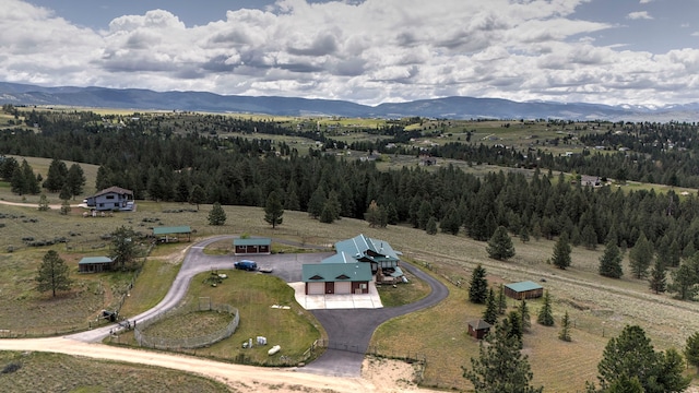 drone / aerial view featuring a mountain view and a rural view