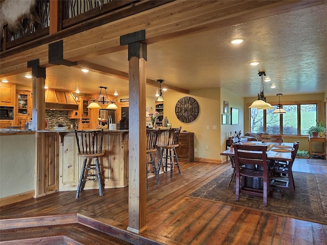856 Weber Butte Trl, Corvallis, MT 59828 - dining area featuring hardwood / wood-style floors, recessed lighting, and beam ceiling