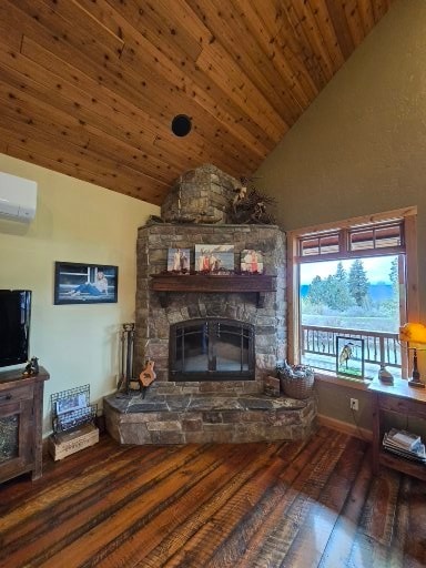 856 Weber Butte Trl, Corvallis, MT 59828 - living room featuring a stone fireplace, lofted ceiling, wood-type flooring, a wall unit AC, and wooden ceiling