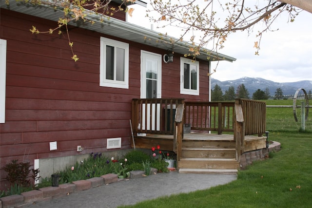 856 Weber Butte Trl, Corvallis, MT 59828 - wooden deck featuring a mountain view and a yard
