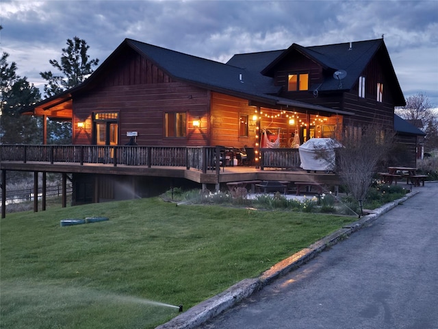 856 Weber Butte Trl, Corvallis, MT 59828 - rear view of property with a wooden deck and a lawn