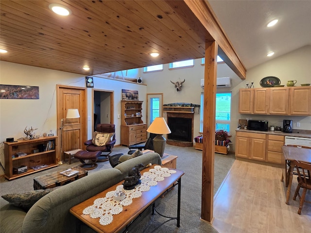 856 Weber Butte Trl, Corvallis, MT 59828 - living area featuring a wall mounted air conditioner, recessed lighting, a fireplace with raised hearth, light wood-style floors, and wood ceiling
