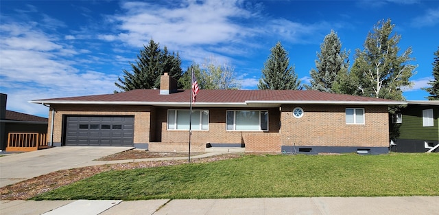 ranch-style home featuring a garage and a front lawn