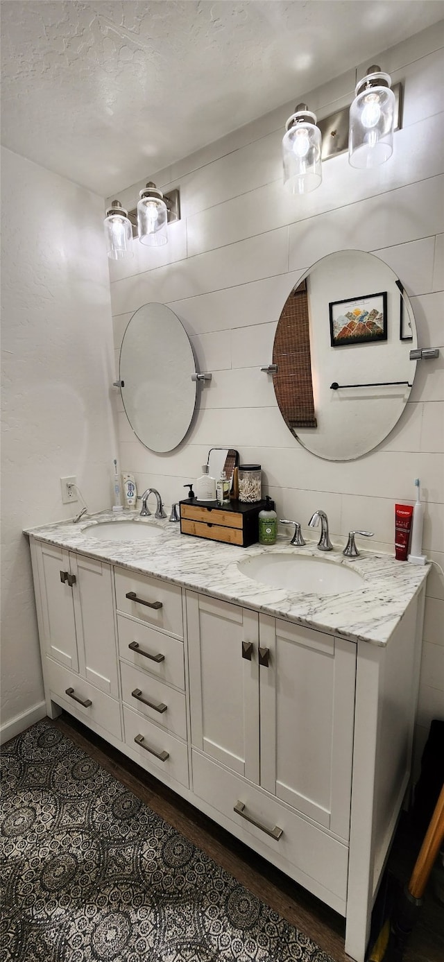 bathroom with vanity and a textured ceiling