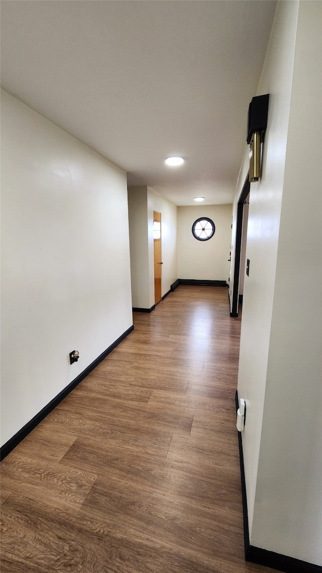 spare room with wood-type flooring