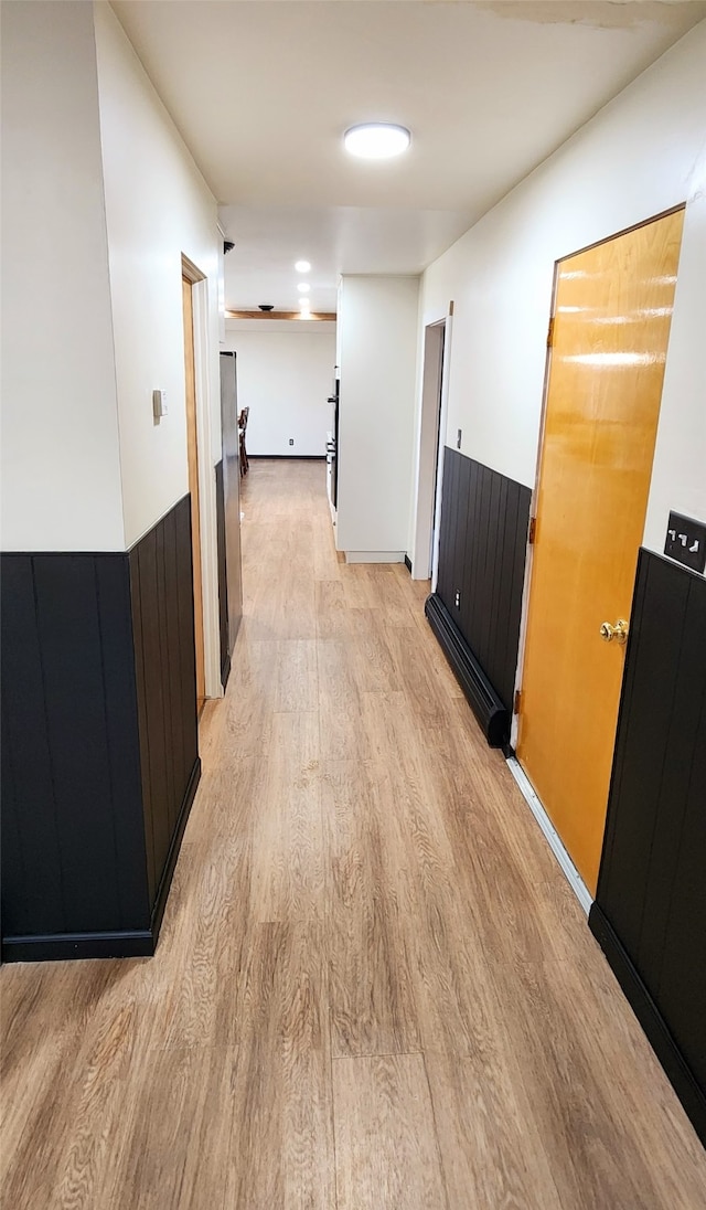 hallway with light wood-type flooring