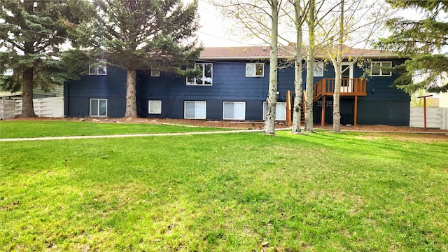 rear view of house with a lawn