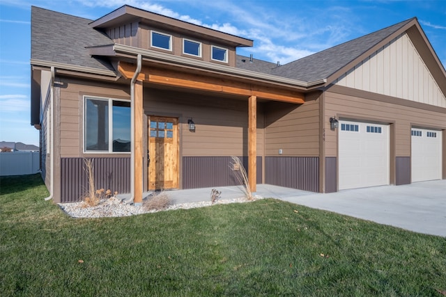 view of front facade with a garage and a front lawn