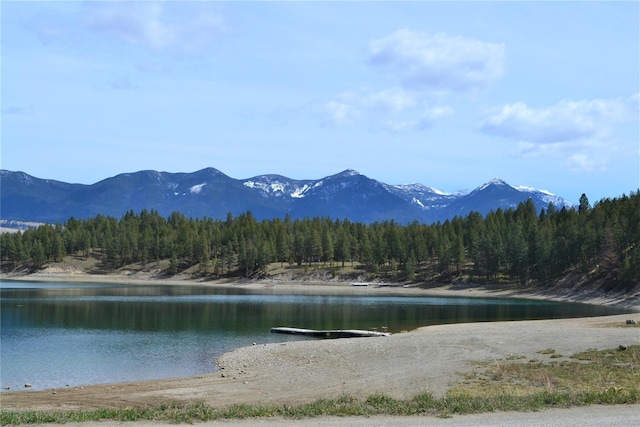 3653 Sophie Lake Rd, Eureka, MT 59917 - water view with a heavily wooded area and a mountain backdrop