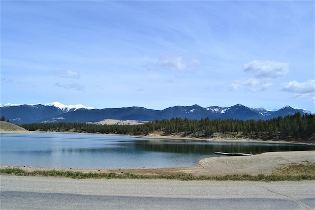 3653 Sophie Lake Rd, Eureka, MT 59917 - water view featuring a mountainous background and a forest