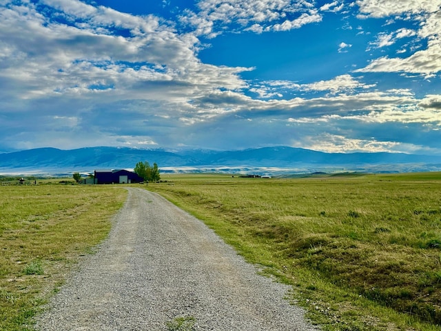 property view of mountains featuring a rural view