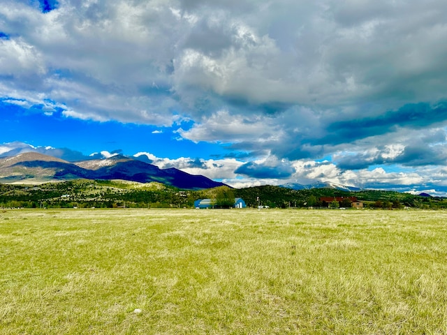 view of mountain feature with a rural view