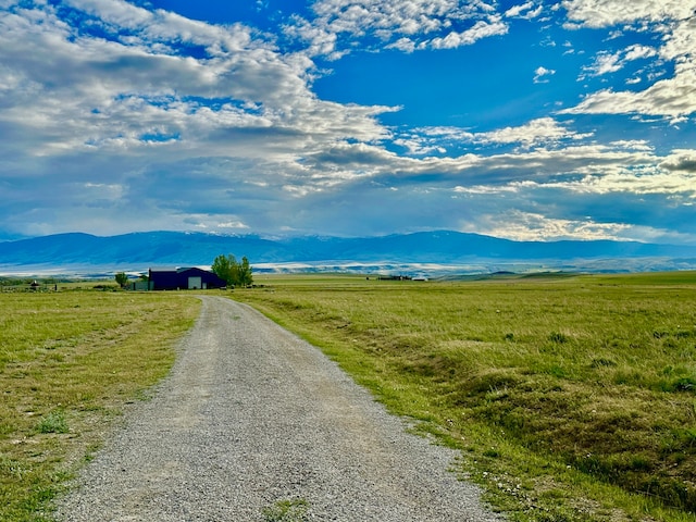 view of street featuring a rural view and a mountain view