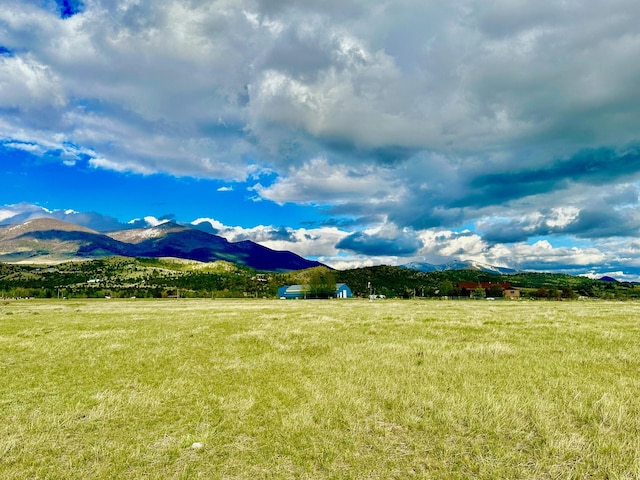 property view of mountains featuring a rural view