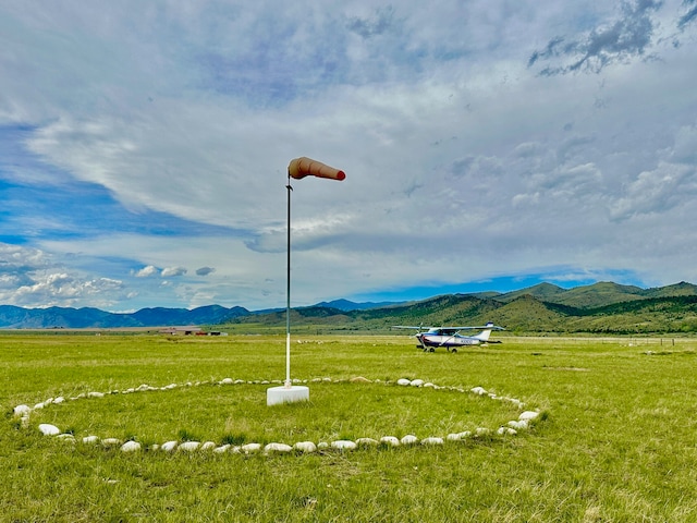 view of nearby features with a rural view and a mountain view