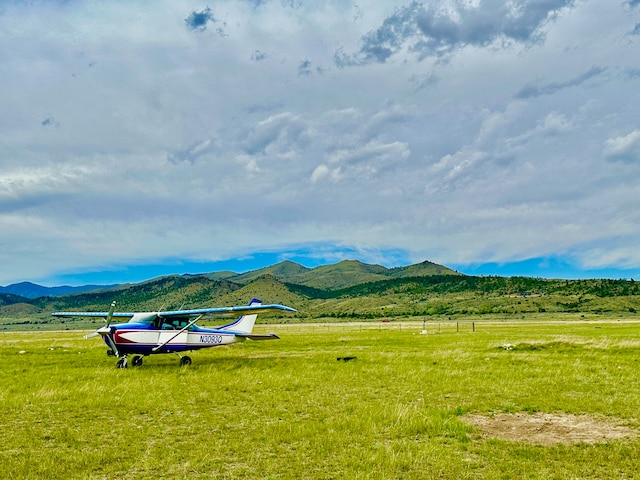 mountain view featuring a rural view