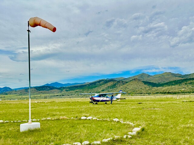 property view of mountains featuring a rural view