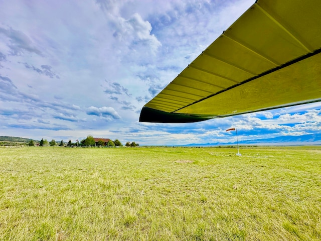 view of yard with a rural view