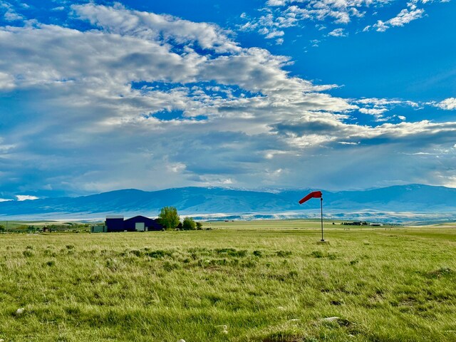 property view of mountains featuring a rural view