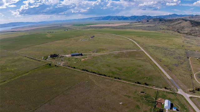 birds eye view of property featuring a rural view and a mountain view