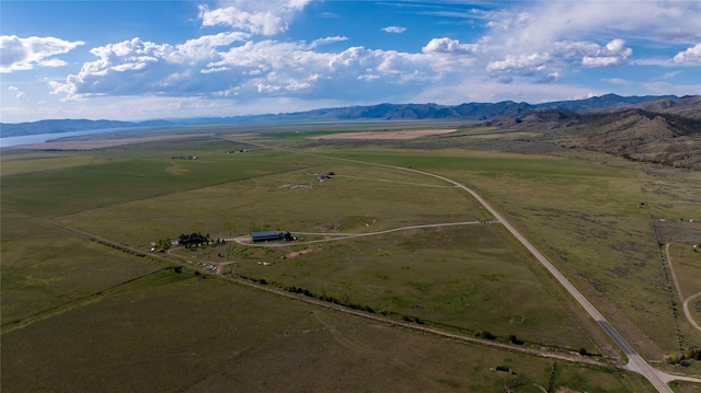 bird's eye view featuring a rural view and a mountain view