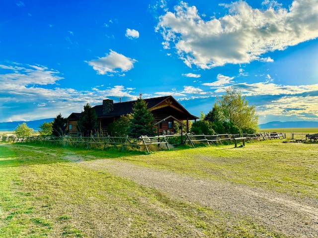 exterior space with a yard and a rural view