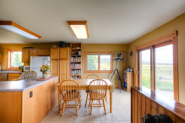 dining area with light tile flooring