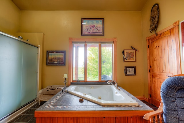 bathroom featuring tile flooring and independent shower and bath