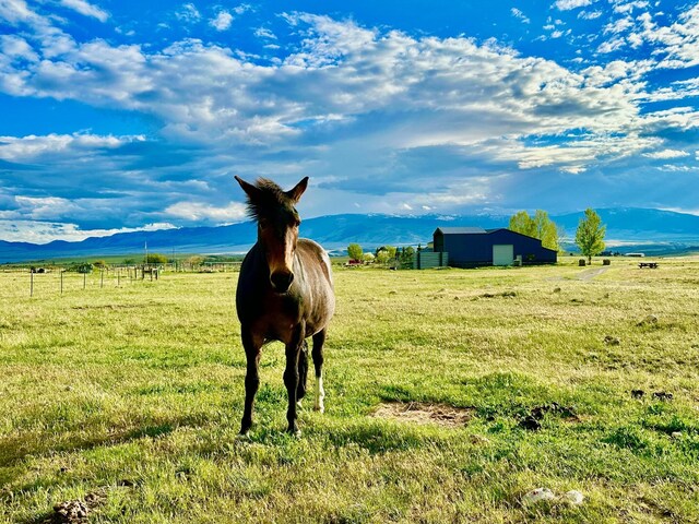 property view of mountains featuring a rural view