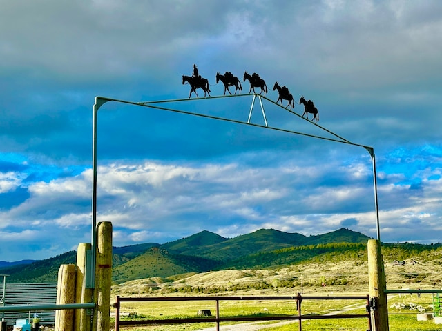 mountain view featuring a rural view