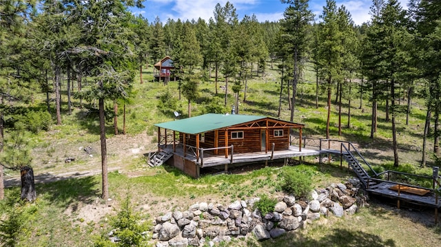 back of house featuring a deck