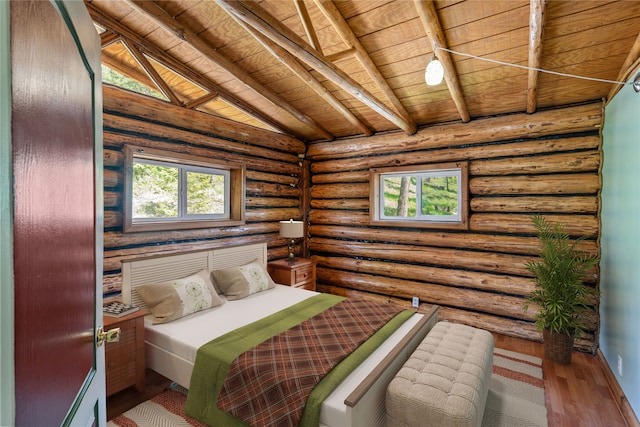 bedroom featuring wooden ceiling, lofted ceiling with beams, log walls, and hardwood / wood-style floors