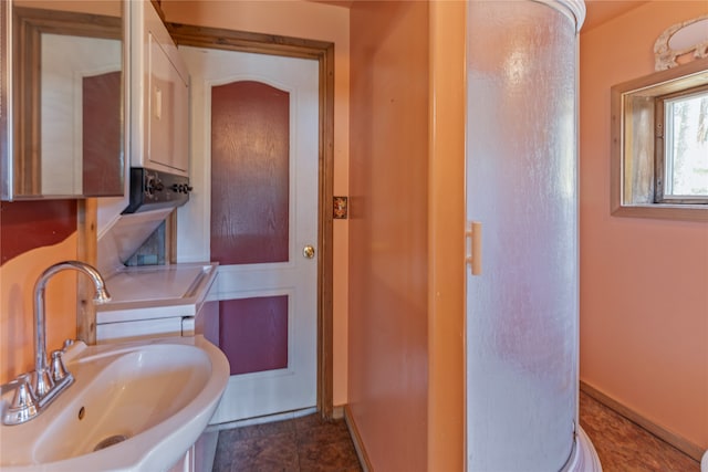 bathroom featuring tile flooring and sink