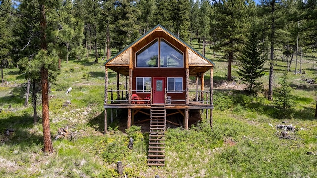 rear view of house with a wooden deck