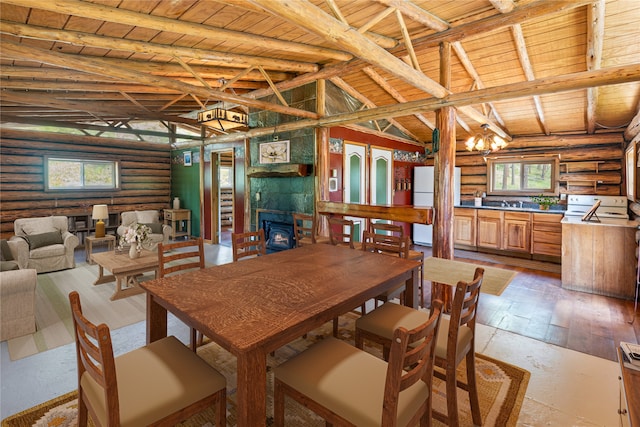 dining room featuring lofted ceiling with beams, hardwood / wood-style flooring, rustic walls, and wooden ceiling