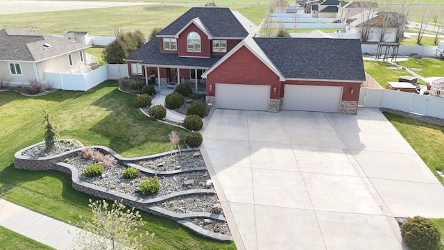 view of front facade with a garage and a front lawn