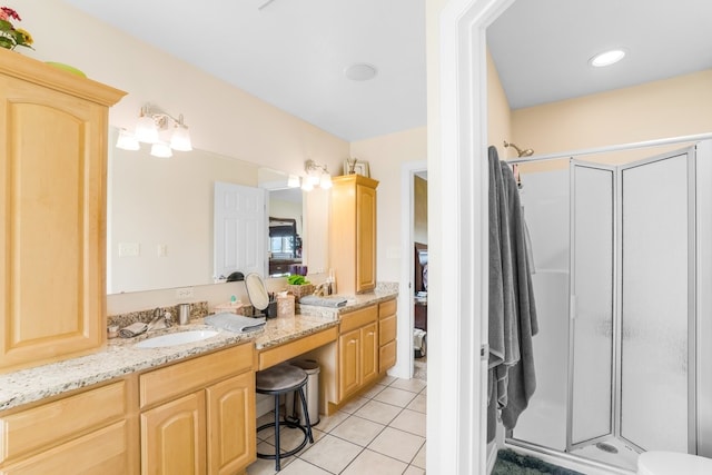 bathroom featuring dual bowl vanity, tile flooring, walk in shower, and toilet