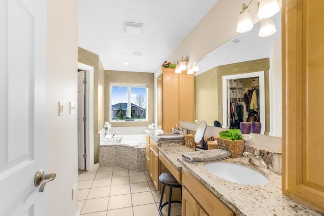 bathroom featuring tile floors, a washtub, oversized vanity, and double sink