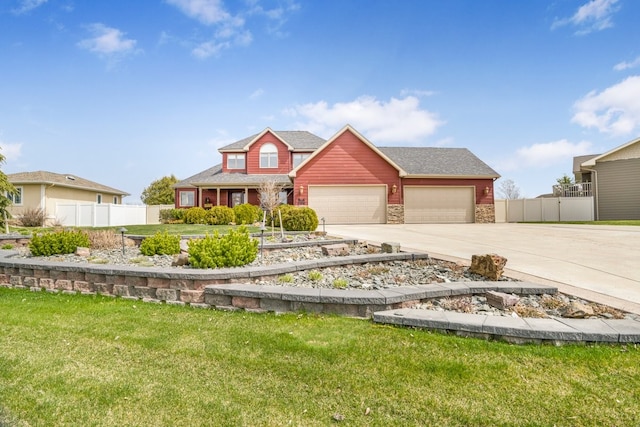 view of front of property featuring a front lawn and a garage