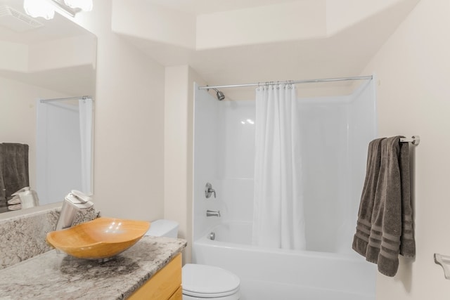 full bathroom with vanity, toilet, and shower / tub combo