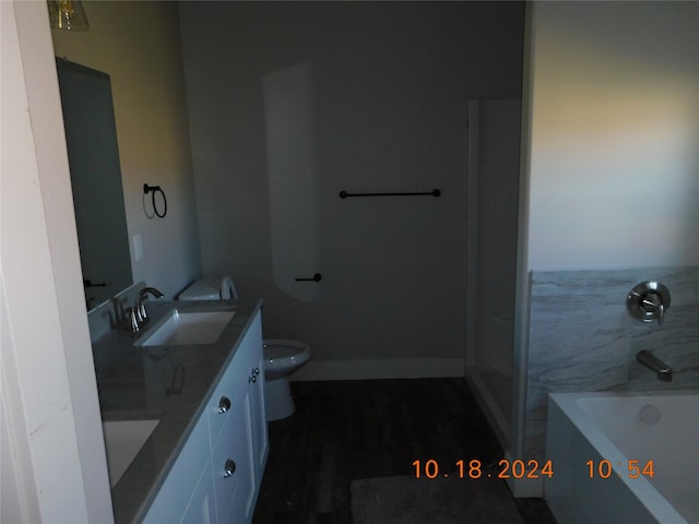 full bathroom with vanity, separate shower and tub, wood-type flooring, and toilet