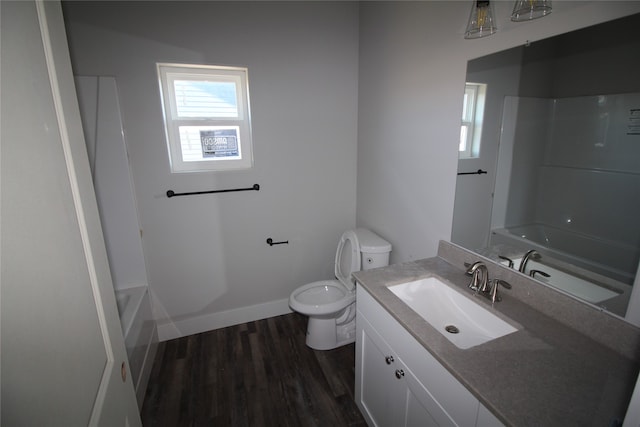 full bathroom with vanity, hardwood / wood-style floors, shower / tub combination, and toilet